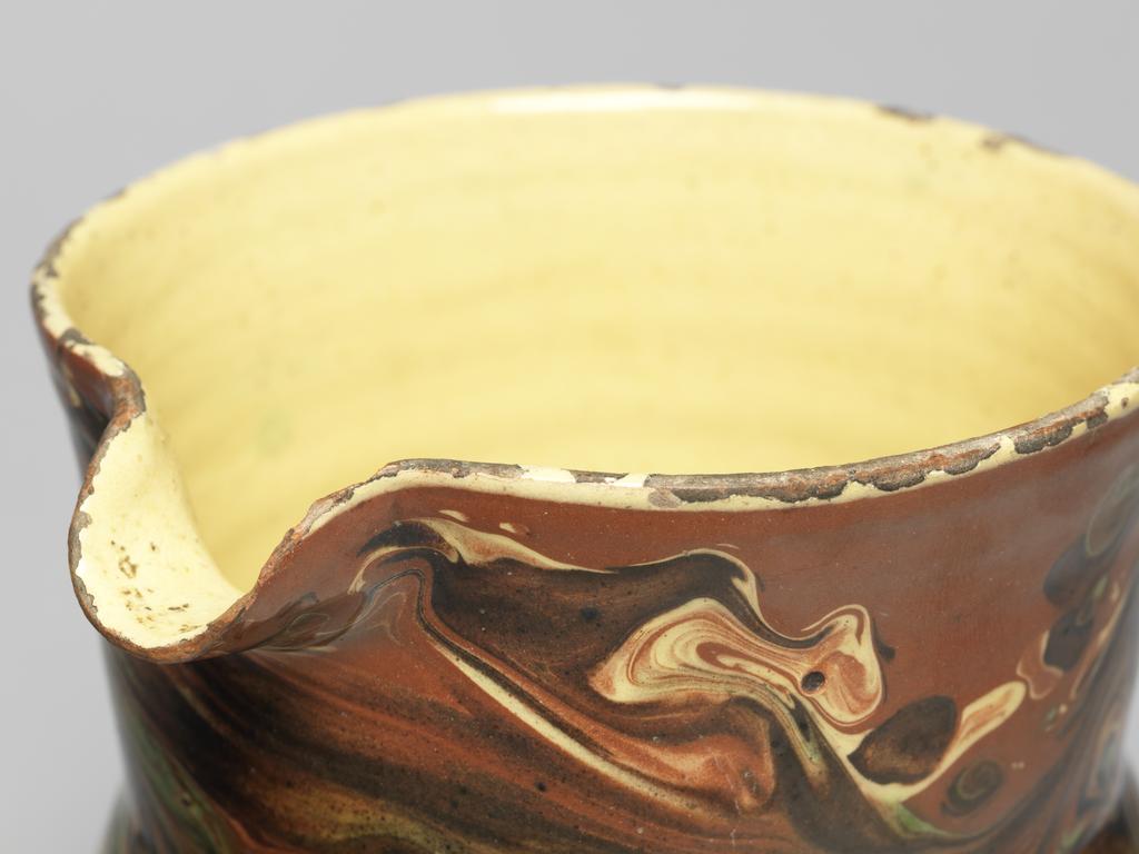 An image of Jug. Production place: Langnau, Switzerland. Lead-glazed earthenware.