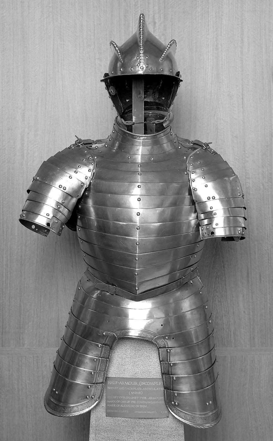 An image of Armour. Composite half armour consisting of a burgonet, cuirass, skirt and tassets and a pair of pauldrons. Mainly made in South Germany. Steel, hammered, formed, riveted, c. 1540-1600.