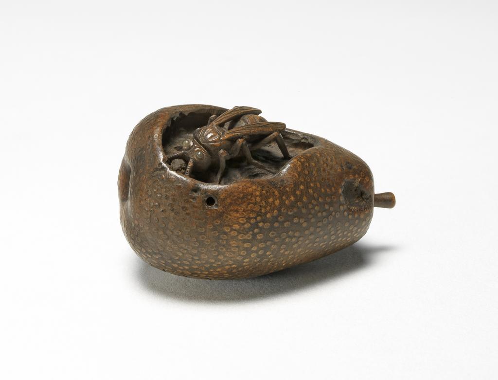 An image of Wooden netsuke. A wasp eating a pear. Ikkyū (Japanese). Wood, height 4 cm. Japanese.