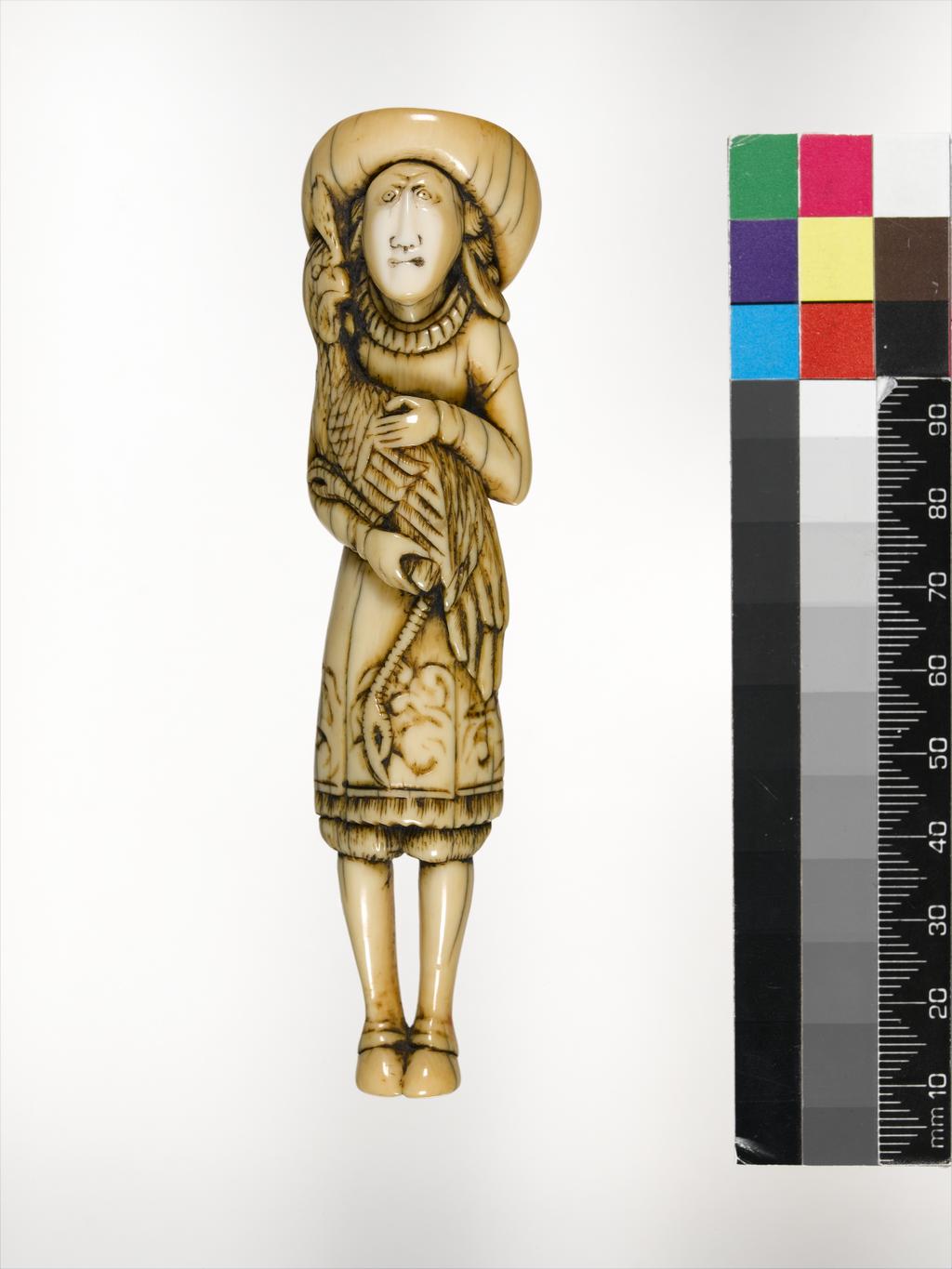 An image of Netsuke. Dutchman with rooster. Unknown carver, Japan. Carved ivory, height 11.6 cm, 1700-1799. Unsigned. Japanese.