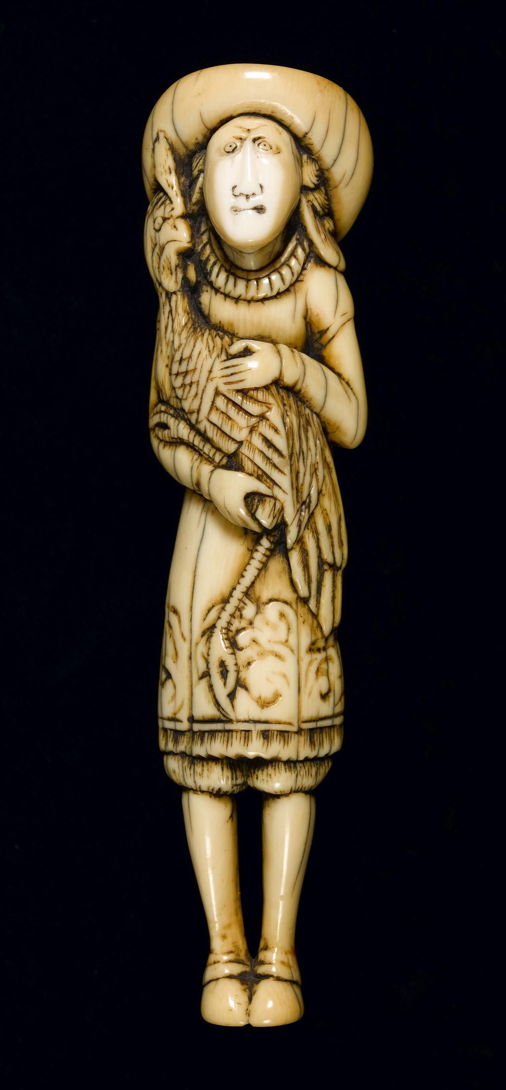 An image of Netsuke. Dutchman with rooster. Unknown carver, Japan. Carved ivory, height 11.6 cm, 1700-1799. Unsigned. Japanese.