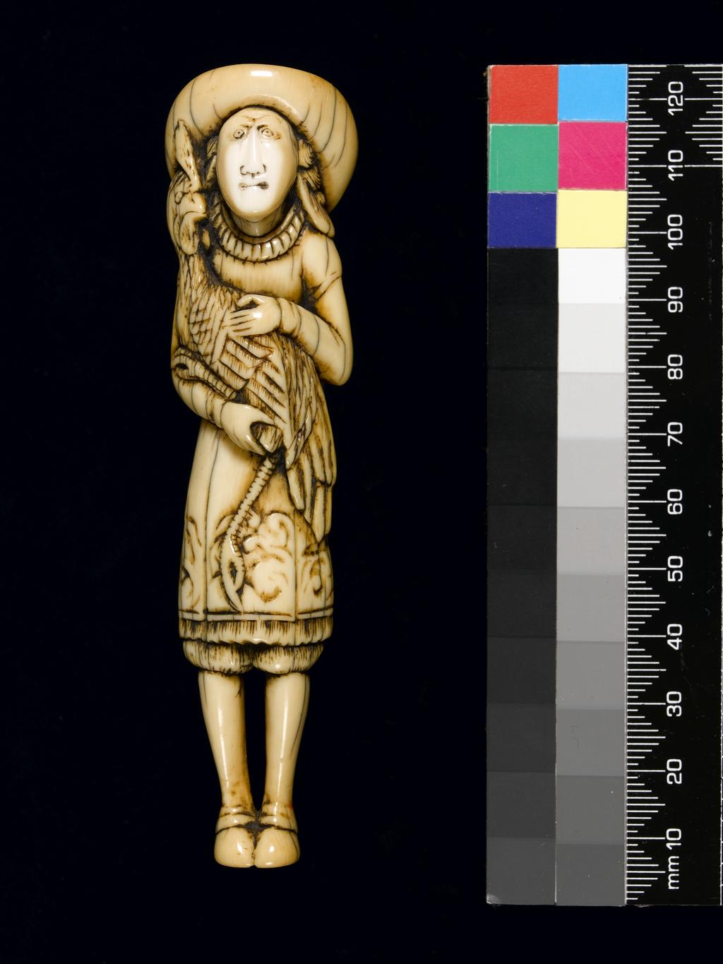 An image of Netsuke. Dutchman with rooster. Unknown carver, Japan. Carved ivory, height 11.6 cm, 1700-1799. Unsigned. Japanese.