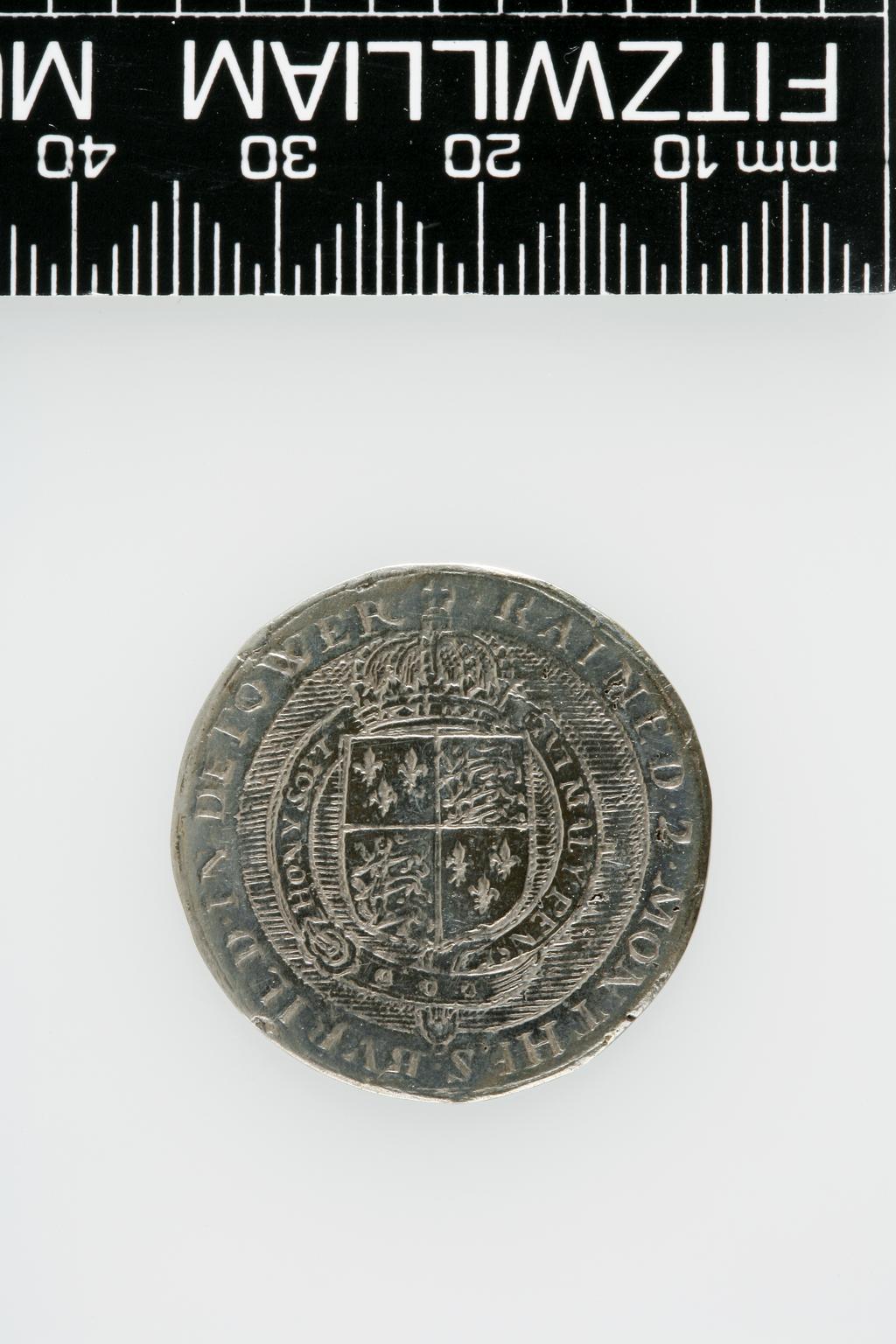 An image of Counter Box containing 32 countersCounter box. Silver, the box pierced, chased, and engraved, containing thirty-two engraved silver counters of English monarchs and their childrenCounter box. Silver, the box pierced, chased, and engraved; the counters engraved. The box is cylindrical with a detachable lid. The base is decorated with a bust of Queen Henrietta Maria in profile to left in low relief in an open oval medallion with pairs of inwards scrolls above and below, and S-scrolls on either side, with a cut away background. The top bears a bust of Charles I in profile to left in an open oval medallion surrounded by four paired scrolls with single scrolls between them, with a cut away background. The sides have two panels each containing pierced scrolling foliage and a monster. The counters are circular, and are engraved with monarchs and coats-of-arms respectively on the two sides: Prince Charles (d. 1130), Edward the Confessor, Willima I (2), William II, John, Edward I, Edward II, Edward III, Edward IV, Edward V, Edward VI, Henry I, Henry II, Henry III, Henry IV, Henry V, Henry VI (2), Henry VII, Henry VIII, Richard I, Richard II, Richard III, Mary I (2), Elizabeth I, Henry father of King James I and VI, James I and VI, Charles I, Elizabeth of Bohemia (his sister), Charles Louis Count of the Palatinate (her son)EnglishC.1640-50