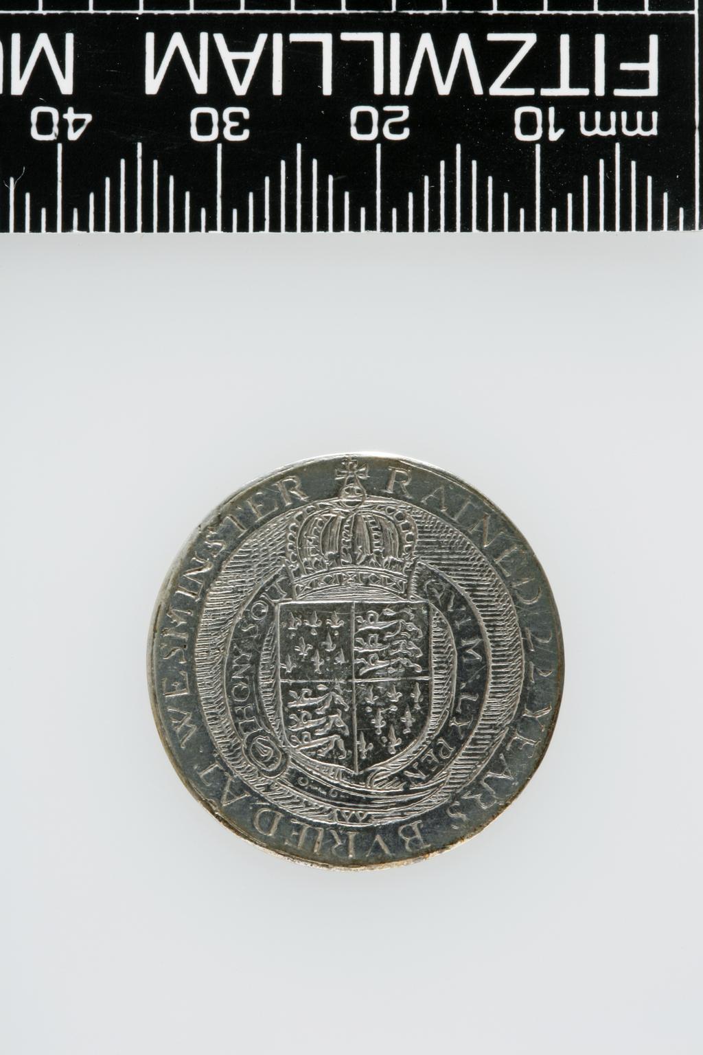 An image of Counter Box containing 32 countersCounter box. Silver, the box pierced, chased, and engraved, containing thirty-two engraved silver counters of English monarchs and their childrenCounter box. Silver, the box pierced, chased, and engraved; the counters engraved. The box is cylindrical with a detachable lid. The base is decorated with a bust of Queen Henrietta Maria in profile to left in low relief in an open oval medallion with pairs of inwards scrolls above and below, and S-scrolls on either side, with a cut away background. The top bears a bust of Charles I in profile to left in an open oval medallion surrounded by four paired scrolls with single scrolls between them, with a cut away background. The sides have two panels each containing pierced scrolling foliage and a monster. The counters are circular, and are engraved with monarchs and coats-of-arms respectively on the two sides: Prince Charles (d. 1130), Edward the Confessor, Willima I (2), William II, John, Edward I, Edward II, Edward III, Edward IV, Edward V, Edward VI, Henry I, Henry II, Henry III, Henry IV, Henry V, Henry VI (2), Henry VII, Henry VIII, Richard I, Richard II, Richard III, Mary I (2), Elizabeth I, Henry father of King James I and VI, James I and VI, Charles I, Elizabeth of Bohemia (his sister), Charles Louis Count of the Palatinate (her son)EnglishC.1640-50