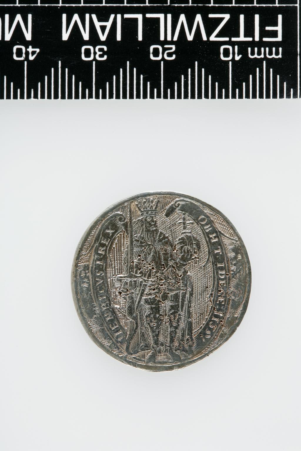 An image of Counter Box containing 32 countersCounter box. Silver, the box pierced, chased, and engraved, containing thirty-two engraved silver counters of English monarchs and their childrenCounter box. Silver, the box pierced, chased, and engraved; the counters engraved. The box is cylindrical with a detachable lid. The base is decorated with a bust of Queen Henrietta Maria in profile to left in low relief in an open oval medallion with pairs of inwards scrolls above and below, and S-scrolls on either side, with a cut away background. The top bears a bust of Charles I in profile to left in an open oval medallion surrounded by four paired scrolls with single scrolls between them, with a cut away background. The sides have two panels each containing pierced scrolling foliage and a monster. The counters are circular, and are engraved with monarchs and coats-of-arms respectively on the two sides: Prince Charles (d. 1130), Edward the Confessor, Willima I (2), William II, John, Edward I, Edward II, Edward III, Edward IV, Edward V, Edward VI, Henry I, Henry II, Henry III, Henry IV, Henry V, Henry VI (2), Henry VII, Henry VIII, Richard I, Richard II, Richard III, Mary I (2), Elizabeth I, Henry father of King James I and VI, James I and VI, Charles I, Elizabeth of Bohemia (his sister), Charles Louis Count of the Palatinate (her son)EnglishC.1640-50