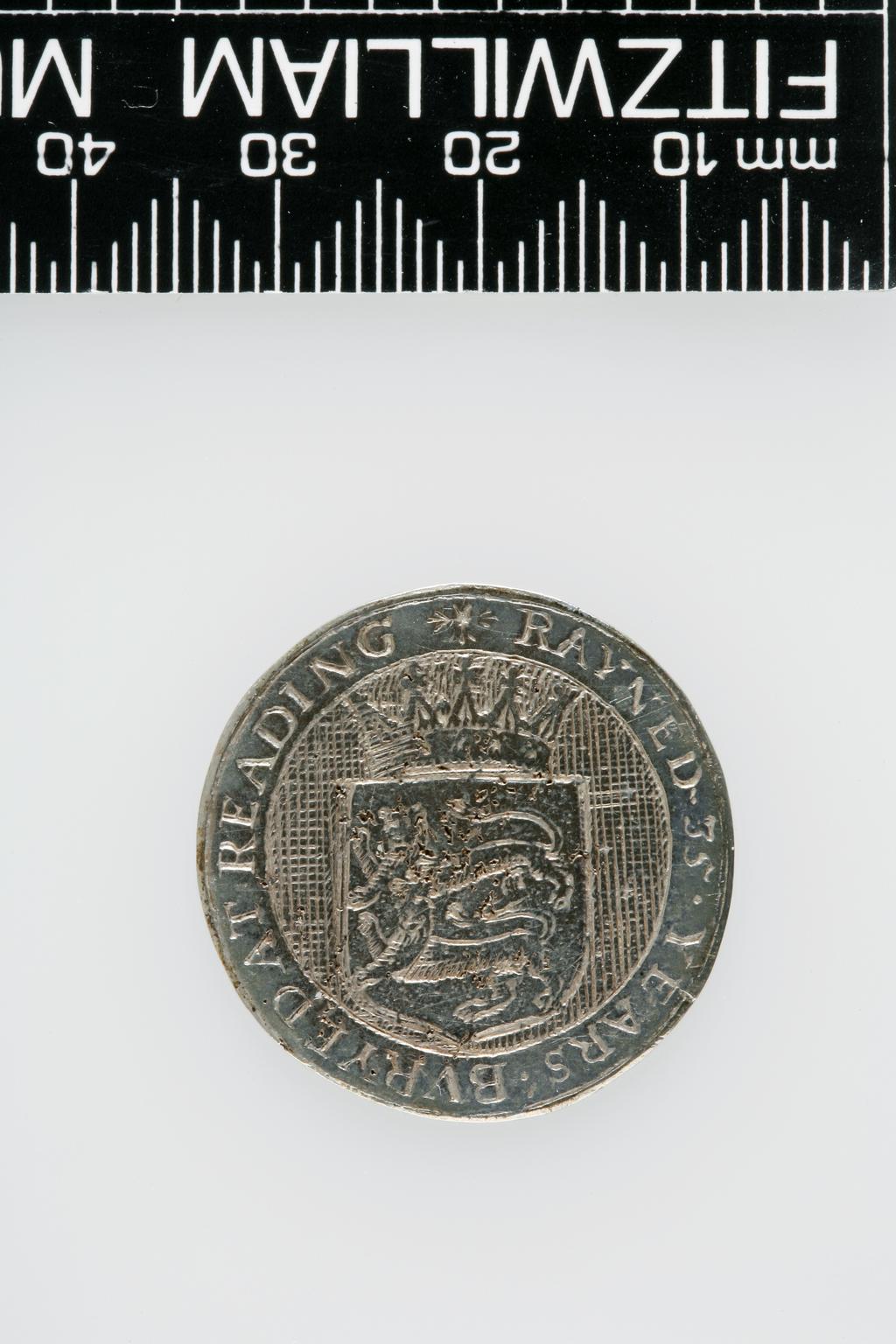 An image of Counter Box containing 32 countersCounter box. Silver, the box pierced, chased, and engraved, containing thirty-two engraved silver counters of English monarchs and their childrenCounter box. Silver, the box pierced, chased, and engraved; the counters engraved. The box is cylindrical with a detachable lid. The base is decorated with a bust of Queen Henrietta Maria in profile to left in low relief in an open oval medallion with pairs of inwards scrolls above and below, and S-scrolls on either side, with a cut away background. The top bears a bust of Charles I in profile to left in an open oval medallion surrounded by four paired scrolls with single scrolls between them, with a cut away background. The sides have two panels each containing pierced scrolling foliage and a monster. The counters are circular, and are engraved with monarchs and coats-of-arms respectively on the two sides: Prince Charles (d. 1130), Edward the Confessor, Willima I (2), William II, John, Edward I, Edward II, Edward III, Edward IV, Edward V, Edward VI, Henry I, Henry II, Henry III, Henry IV, Henry V, Henry VI (2), Henry VII, Henry VIII, Richard I, Richard II, Richard III, Mary I (2), Elizabeth I, Henry father of King James I and VI, James I and VI, Charles I, Elizabeth of Bohemia (his sister), Charles Louis Count of the Palatinate (her son)EnglishC.1640-50