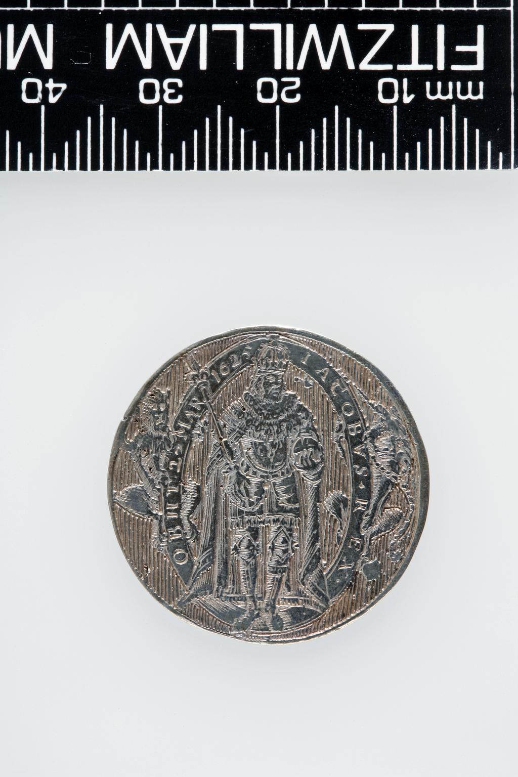 An image of Counter Box containing 32 countersCounter box. Silver, the box pierced, chased, and engraved, containing thirty-two engraved silver counters of English monarchs and their childrenCounter box. Silver, the box pierced, chased, and engraved; the counters engraved. The box is cylindrical with a detachable lid. The base is decorated with a bust of Queen Henrietta Maria in profile to left in low relief in an open oval medallion with pairs of inwards scrolls above and below, and S-scrolls on either side, with a cut away background. The top bears a bust of Charles I in profile to left in an open oval medallion surrounded by four paired scrolls with single scrolls between them, with a cut away background. The sides have two panels each containing pierced scrolling foliage and a monster. The counters are circular, and are engraved with monarchs and coats-of-arms respectively on the two sides: Prince Charles (d. 1130), Edward the Confessor, Willima I (2), William II, John, Edward I, Edward II, Edward III, Edward IV, Edward V, Edward VI, Henry I, Henry II, Henry III, Henry IV, Henry V, Henry VI (2), Henry VII, Henry VIII, Richard I, Richard II, Richard III, Mary I (2), Elizabeth I, Henry father of King James I and VI, James I and VI, Charles I, Elizabeth of Bohemia (his sister), Charles Louis Count of the Palatinate (her son)EnglishC.1640-50