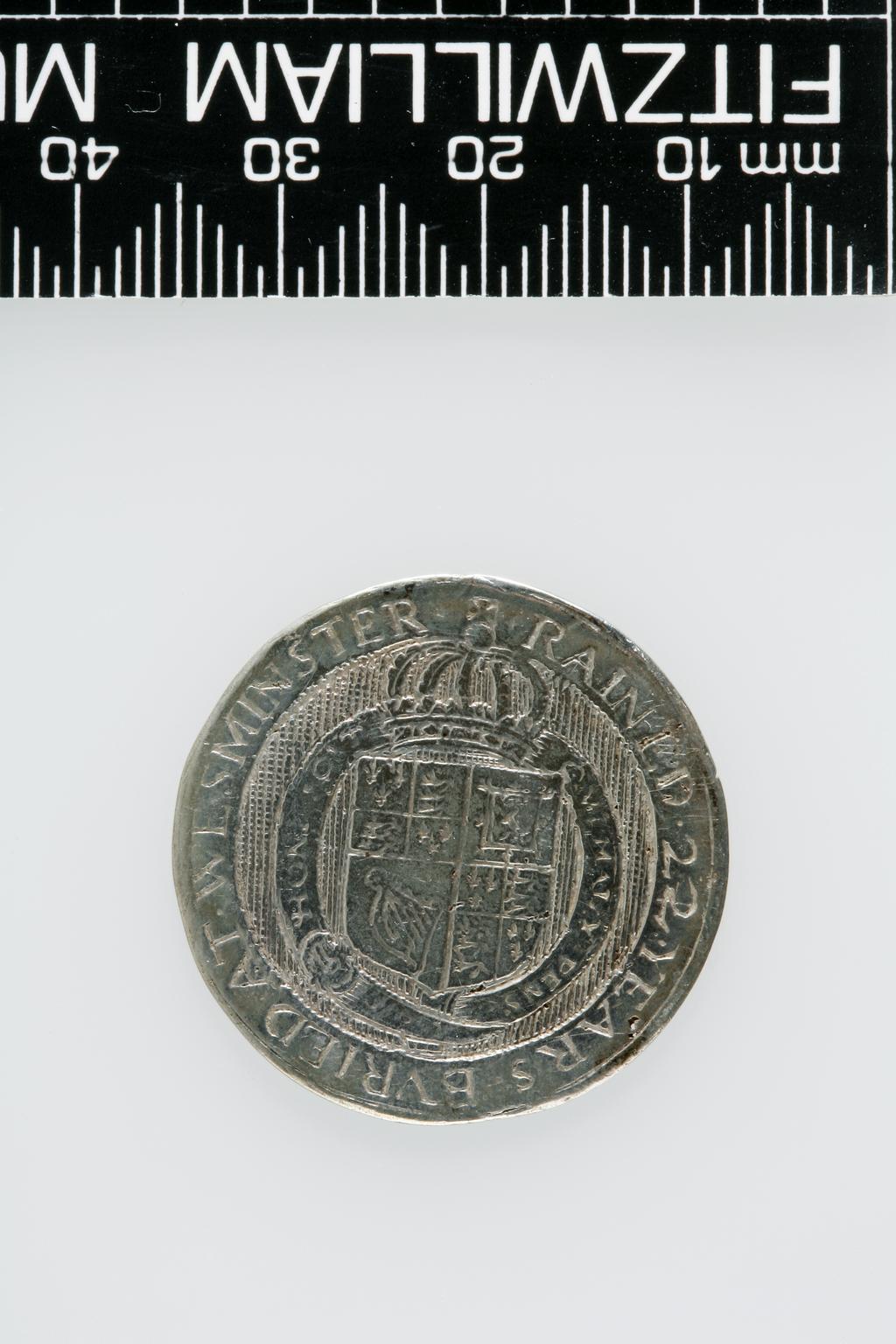 An image of Counter Box containing 32 countersCounter box. Silver, the box pierced, chased, and engraved, containing thirty-two engraved silver counters of English monarchs and their childrenCounter box. Silver, the box pierced, chased, and engraved; the counters engraved. The box is cylindrical with a detachable lid. The base is decorated with a bust of Queen Henrietta Maria in profile to left in low relief in an open oval medallion with pairs of inwards scrolls above and below, and S-scrolls on either side, with a cut away background. The top bears a bust of Charles I in profile to left in an open oval medallion surrounded by four paired scrolls with single scrolls between them, with a cut away background. The sides have two panels each containing pierced scrolling foliage and a monster. The counters are circular, and are engraved with monarchs and coats-of-arms respectively on the two sides: Prince Charles (d. 1130), Edward the Confessor, Willima I (2), William II, John, Edward I, Edward II, Edward III, Edward IV, Edward V, Edward VI, Henry I, Henry II, Henry III, Henry IV, Henry V, Henry VI (2), Henry VII, Henry VIII, Richard I, Richard II, Richard III, Mary I (2), Elizabeth I, Henry father of King James I and VI, James I and VI, Charles I, Elizabeth of Bohemia (his sister), Charles Louis Count of the Palatinate (her son)EnglishC.1640-50