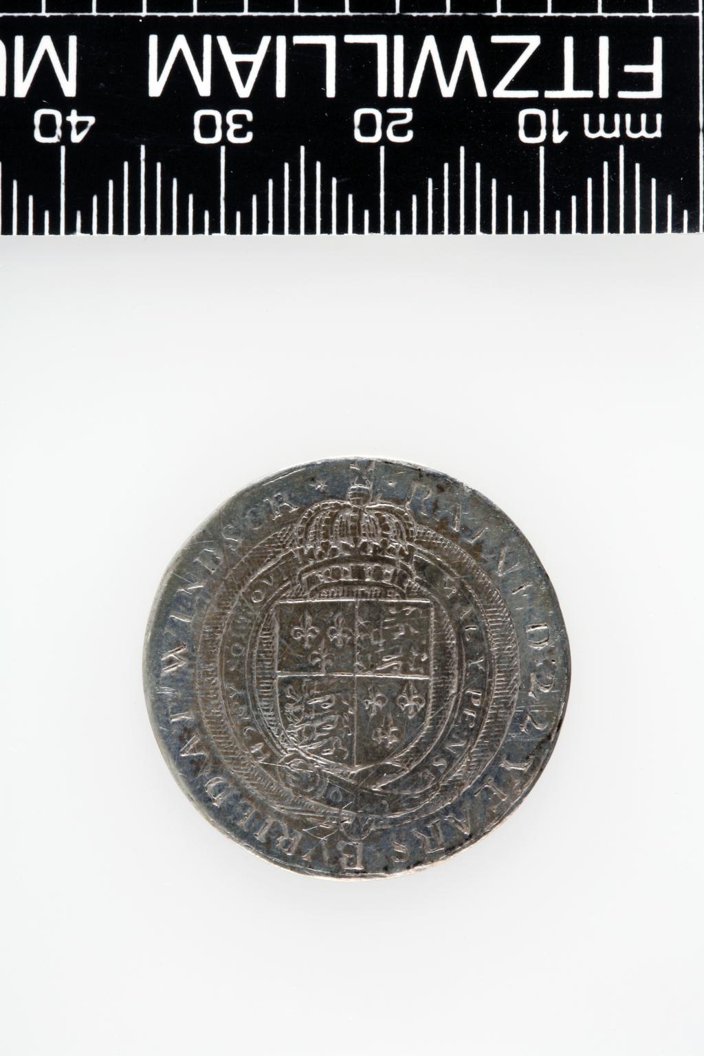 An image of Counter Box containing 32 countersCounter box. Silver, the box pierced, chased, and engraved, containing thirty-two engraved silver counters of English monarchs and their childrenCounter box. Silver, the box pierced, chased, and engraved; the counters engraved. The box is cylindrical with a detachable lid. The base is decorated with a bust of Queen Henrietta Maria in profile to left in low relief in an open oval medallion with pairs of inwards scrolls above and below, and S-scrolls on either side, with a cut away background. The top bears a bust of Charles I in profile to left in an open oval medallion surrounded by four paired scrolls with single scrolls between them, with a cut away background. The sides have two panels each containing pierced scrolling foliage and a monster. The counters are circular, and are engraved with monarchs and coats-of-arms respectively on the two sides: Prince Charles (d. 1130), Edward the Confessor, Willima I (2), William II, John, Edward I, Edward II, Edward III, Edward IV, Edward V, Edward VI, Henry I, Henry II, Henry III, Henry IV, Henry V, Henry VI (2), Henry VII, Henry VIII, Richard I, Richard II, Richard III, Mary I (2), Elizabeth I, Henry father of King James I and VI, James I and VI, Charles I, Elizabeth of Bohemia (his sister), Charles Louis Count of the Palatinate (her son)EnglishC.1640-50