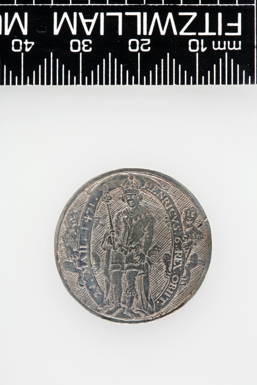 An image of Counter Box containing 32 countersCounter box. Silver, the box pierced, chased, and engraved, containing thirty-two engraved silver counters of English monarchs and their childrenCounter box. Silver, the box pierced, chased, and engraved; the counters engraved. The box is cylindrical with a detachable lid. The base is decorated with a bust of Queen Henrietta Maria in profile to left in low relief in an open oval medallion with pairs of inwards scrolls above and below, and S-scrolls on either side, with a cut away background. The top bears a bust of Charles I in profile to left in an open oval medallion surrounded by four paired scrolls with single scrolls between them, with a cut away background. The sides have two panels each containing pierced scrolling foliage and a monster. The counters are circular, and are engraved with monarchs and coats-of-arms respectively on the two sides: Prince Charles (d. 1130), Edward the Confessor, Willima I (2), William II, John, Edward I, Edward II, Edward III, Edward IV, Edward V, Edward VI, Henry I, Henry II, Henry III, Henry IV, Henry V, Henry VI (2), Henry VII, Henry VIII, Richard I, Richard II, Richard III, Mary I (2), Elizabeth I, Henry father of King James I and VI, James I and VI, Charles I, Elizabeth of Bohemia (his sister), Charles Louis Count of the Palatinate (her son)EnglishC.1640-50