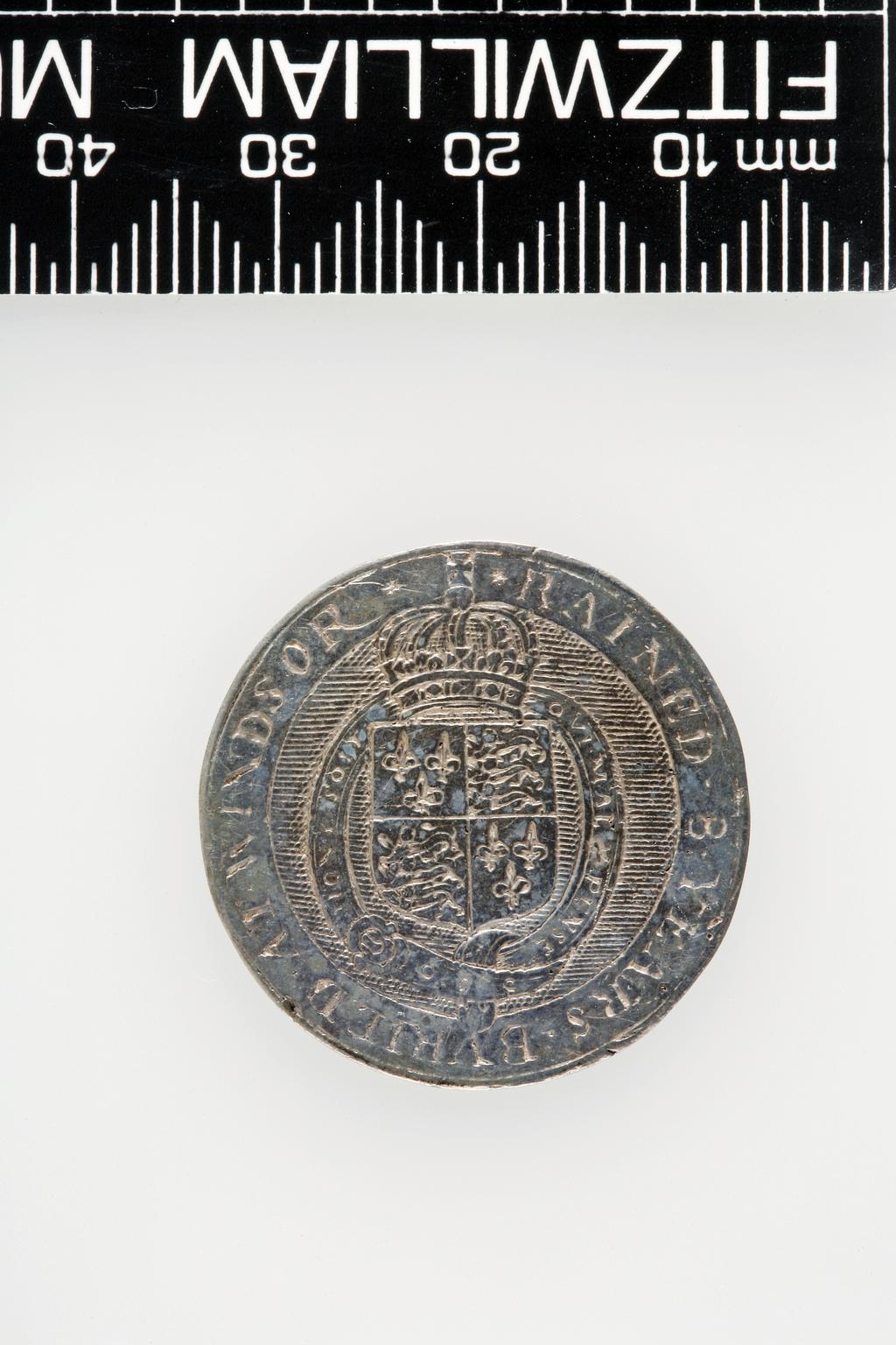 An image of Counter Box containing 32 countersCounter box. Silver, the box pierced, chased, and engraved, containing thirty-two engraved silver counters of English monarchs and their childrenCounter box. Silver, the box pierced, chased, and engraved; the counters engraved. The box is cylindrical with a detachable lid. The base is decorated with a bust of Queen Henrietta Maria in profile to left in low relief in an open oval medallion with pairs of inwards scrolls above and below, and S-scrolls on either side, with a cut away background. The top bears a bust of Charles I in profile to left in an open oval medallion surrounded by four paired scrolls with single scrolls between them, with a cut away background. The sides have two panels each containing pierced scrolling foliage and a monster. The counters are circular, and are engraved with monarchs and coats-of-arms respectively on the two sides: Prince Charles (d. 1130), Edward the Confessor, Willima I (2), William II, John, Edward I, Edward II, Edward III, Edward IV, Edward V, Edward VI, Henry I, Henry II, Henry III, Henry IV, Henry V, Henry VI (2), Henry VII, Henry VIII, Richard I, Richard II, Richard III, Mary I (2), Elizabeth I, Henry father of King James I and VI, James I and VI, Charles I, Elizabeth of Bohemia (his sister), Charles Louis Count of the Palatinate (her son)EnglishC.1640-50