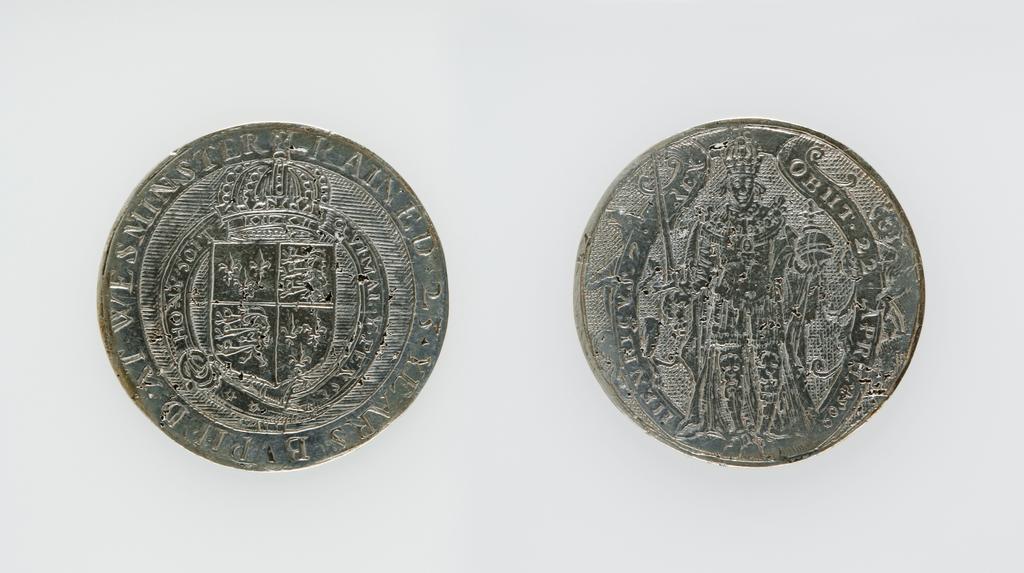 An image of Counter Box containing 32 countersCounter box. Silver, the box pierced, chased, and engraved, containing thirty-two engraved silver counters of English monarchs and their childrenCounter box. Silver, the box pierced, chased, and engraved; the counters engraved. The box is cylindrical with a detachable lid. The base is decorated with a bust of Queen Henrietta Maria in profile to left in low relief in an open oval medallion with pairs of inwards scrolls above and below, and S-scrolls on either side, with a cut away background. The top bears a bust of Charles I in profile to left in an open oval medallion surrounded by four paired scrolls with single scrolls between them, with a cut away background. The sides have two panels each containing pierced scrolling foliage and a monster. The counters are circular, and are engraved with monarchs and coats-of-arms respectively on the two sides: Prince Charles (d. 1130), Edward the Confessor, Willima I (2), William II, John, Edward I, Edward II, Edward III, Edward IV, Edward V, Edward VI, Henry I, Henry II, Henry III, Henry IV, Henry V, Henry VI (2), Henry VII, Henry VIII, Richard I, Richard II, Richard III, Mary I (2), Elizabeth I, Henry father of King James I and VI, James I and VI, Charles I, Elizabeth of Bohemia (his sister), Charles Louis Count of the Palatinate (her son)EnglishC.1640-50