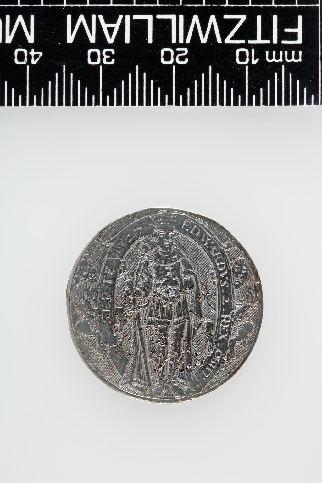 An image of Counter Box containing 32 countersCounter box. Silver, the box pierced, chased, and engraved, containing thirty-two engraved silver counters of English monarchs and their childrenCounter box. Silver, the box pierced, chased, and engraved; the counters engraved. The box is cylindrical with a detachable lid. The base is decorated with a bust of Queen Henrietta Maria in profile to left in low relief in an open oval medallion with pairs of inwards scrolls above and below, and S-scrolls on either side, with a cut away background. The top bears a bust of Charles I in profile to left in an open oval medallion surrounded by four paired scrolls with single scrolls between them, with a cut away background. The sides have two panels each containing pierced scrolling foliage and a monster. The counters are circular, and are engraved with monarchs and coats-of-arms respectively on the two sides: Prince Charles (d. 1130), Edward the Confessor, Willima I (2), William II, John, Edward I, Edward II, Edward III, Edward IV, Edward V, Edward VI, Henry I, Henry II, Henry III, Henry IV, Henry V, Henry VI (2), Henry VII, Henry VIII, Richard I, Richard II, Richard III, Mary I (2), Elizabeth I, Henry father of King James I and VI, James I and VI, Charles I, Elizabeth of Bohemia (his sister), Charles Louis Count of the Palatinate (her son)EnglishC.1640-50