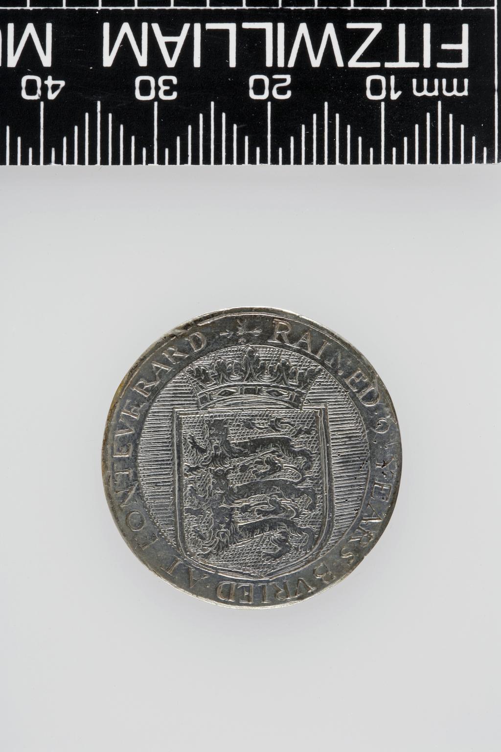 An image of Counter Box containing 32 countersCounter box. Silver, the box pierced, chased, and engraved, containing thirty-two engraved silver counters of English monarchs and their childrenCounter box. Silver, the box pierced, chased, and engraved; the counters engraved. The box is cylindrical with a detachable lid. The base is decorated with a bust of Queen Henrietta Maria in profile to left in low relief in an open oval medallion with pairs of inwards scrolls above and below, and S-scrolls on either side, with a cut away background. The top bears a bust of Charles I in profile to left in an open oval medallion surrounded by four paired scrolls with single scrolls between them, with a cut away background. The sides have two panels each containing pierced scrolling foliage and a monster. The counters are circular, and are engraved with monarchs and coats-of-arms respectively on the two sides: Prince Charles (d. 1130), Edward the Confessor, Willima I (2), William II, John, Edward I, Edward II, Edward III, Edward IV, Edward V, Edward VI, Henry I, Henry II, Henry III, Henry IV, Henry V, Henry VI (2), Henry VII, Henry VIII, Richard I, Richard II, Richard III, Mary I (2), Elizabeth I, Henry father of King James I and VI, James I and VI, Charles I, Elizabeth of Bohemia (his sister), Charles Louis Count of the Palatinate (her son)EnglishC.1640-50