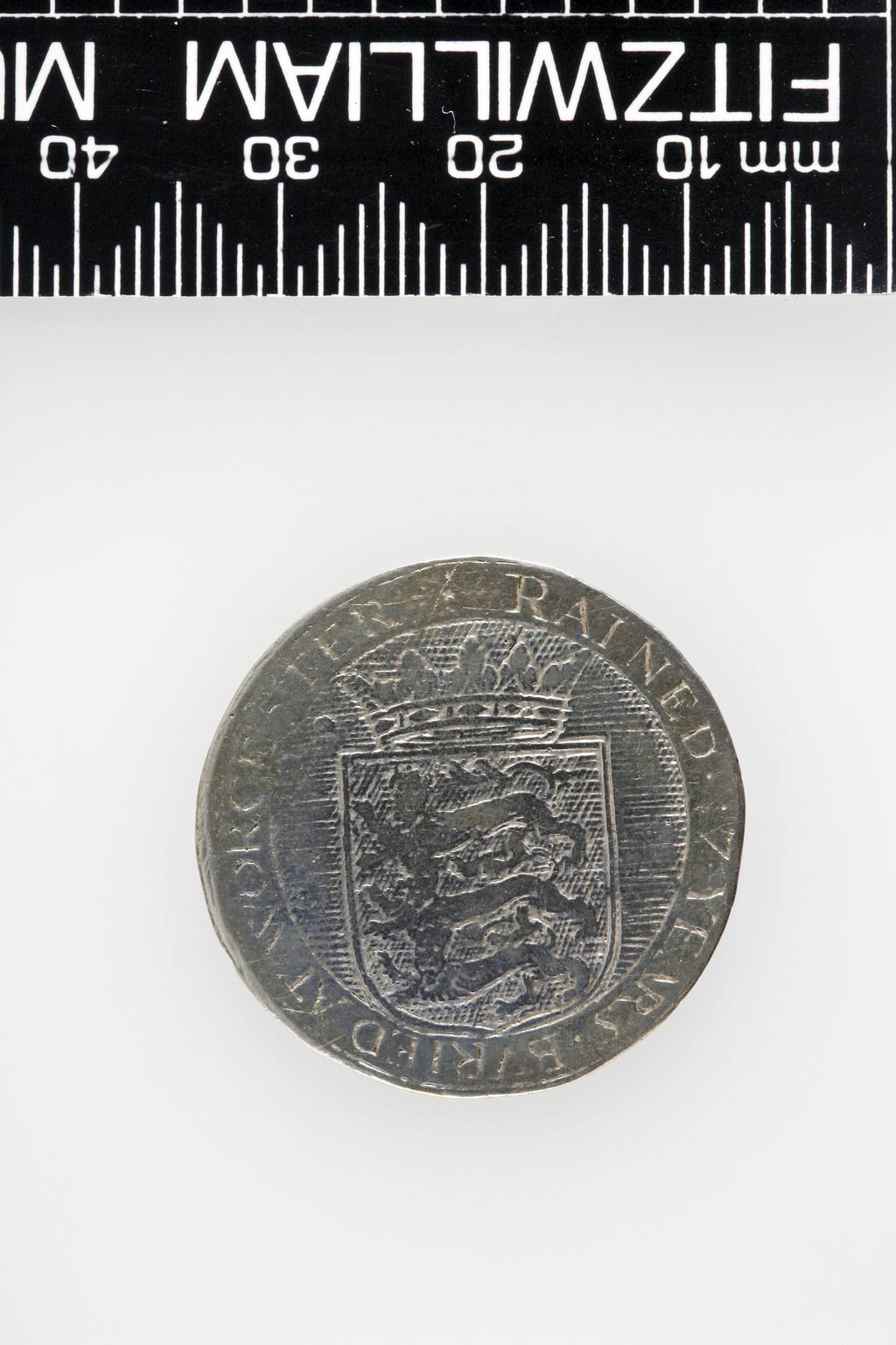 An image of Counter Box containing 32 countersCounter box. Silver, the box pierced, chased, and engraved, containing thirty-two engraved silver counters of English monarchs and their childrenCounter box. Silver, the box pierced, chased, and engraved; the counters engraved. The box is cylindrical with a detachable lid. The base is decorated with a bust of Queen Henrietta Maria in profile to left in low relief in an open oval medallion with pairs of inwards scrolls above and below, and S-scrolls on either side, with a cut away background. The top bears a bust of Charles I in profile to left in an open oval medallion surrounded by four paired scrolls with single scrolls between them, with a cut away background. The sides have two panels each containing pierced scrolling foliage and a monster. The counters are circular, and are engraved with monarchs and coats-of-arms respectively on the two sides: Prince Charles (d. 1130), Edward the Confessor, Willima I (2), William II, John, Edward I, Edward II, Edward III, Edward IV, Edward V, Edward VI, Henry I, Henry II, Henry III, Henry IV, Henry V, Henry VI (2), Henry VII, Henry VIII, Richard I, Richard II, Richard III, Mary I (2), Elizabeth I, Henry father of King James I and VI, James I and VI, Charles I, Elizabeth of Bohemia (his sister), Charles Louis Count of the Palatinate (her son)EnglishC.1640-50