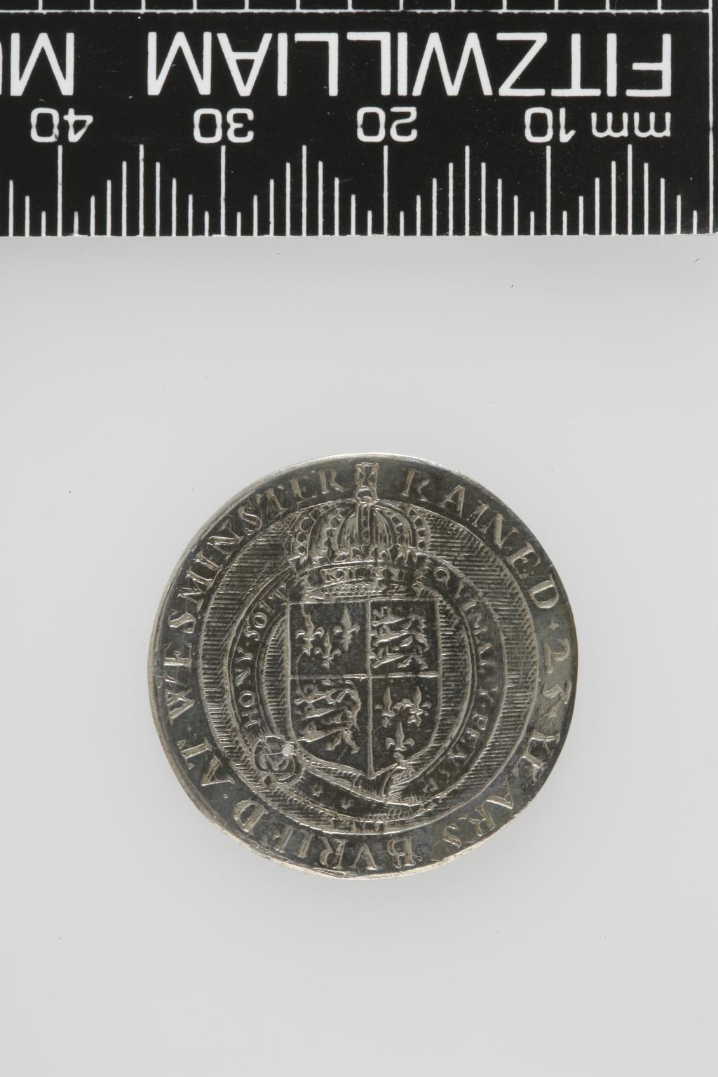 An image of Counter Box containing 32 countersCounter box. Silver, the box pierced, chased, and engraved, containing thirty-two engraved silver counters of English monarchs and their childrenCounter box. Silver, the box pierced, chased, and engraved; the counters engraved. The box is cylindrical with a detachable lid. The base is decorated with a bust of Queen Henrietta Maria in profile to left in low relief in an open oval medallion with pairs of inwards scrolls above and below, and S-scrolls on either side, with a cut away background. The top bears a bust of Charles I in profile to left in an open oval medallion surrounded by four paired scrolls with single scrolls between them, with a cut away background. The sides have two panels each containing pierced scrolling foliage and a monster. The counters are circular, and are engraved with monarchs and coats-of-arms respectively on the two sides: Prince Charles (d. 1130), Edward the Confessor, Willima I (2), William II, John, Edward I, Edward II, Edward III, Edward IV, Edward V, Edward VI, Henry I, Henry II, Henry III, Henry IV, Henry V, Henry VI (2), Henry VII, Henry VIII, Richard I, Richard II, Richard III, Mary I (2), Elizabeth I, Henry father of King James I and VI, James I and VI, Charles I, Elizabeth of Bohemia (his sister), Charles Louis Count of the Palatinate (her son)EnglishC.1640-50