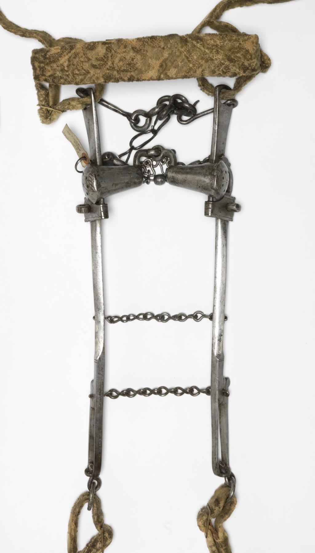 An image of Armour. Bridle component. Steel bit, with original bridle and reins covered with yellow velvet. Unknown production, Germany. Circa 1500-1550. POST-CONSERVATION.