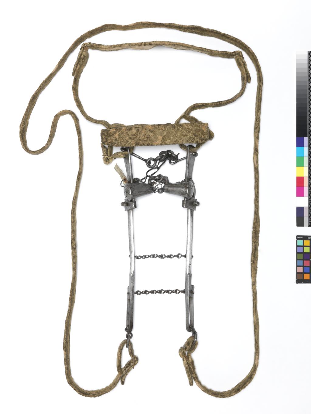 An image of Armour. Bridle component. Steel bit, with original bridle and reins covered with yellow velvet. Unknown production, Germany. Circa 1500-1550. POST-CONSERVATION.