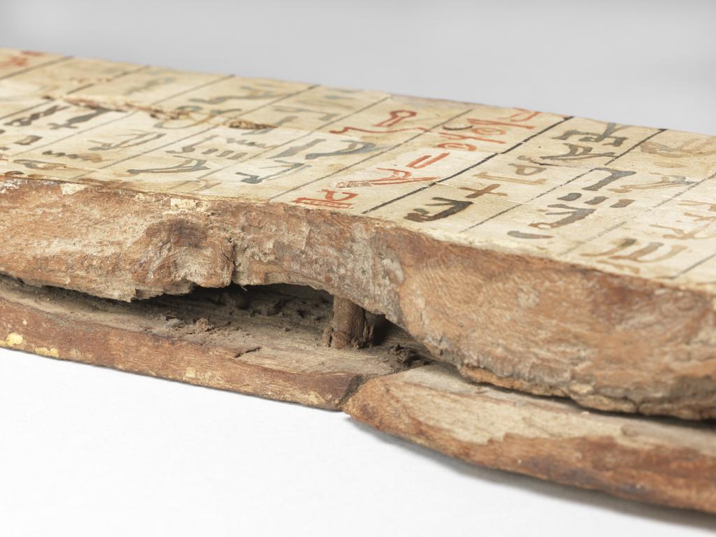 An image of Funerary Equipment. Coffin fragment of an unknown woman. Inscribed with coffin texts. Production Place: Egypt. Find Spot: Asyut (?), Egypt. Wood, painted, height 0.077 m, width 0.727 m, thickness 0.028 m, circa 2055 to circa 1985 B.C. Middle Kingdom.