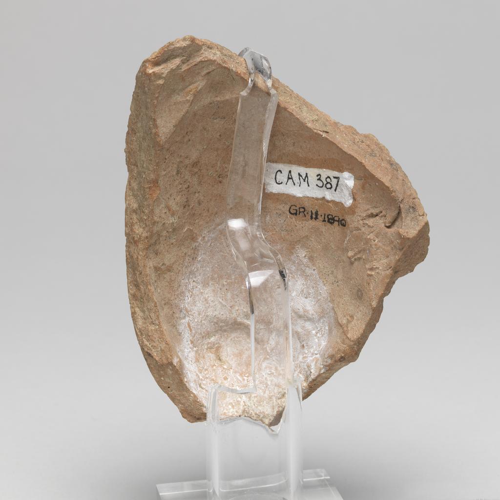 An image of Figure/Head. Male head, wearing cap. Production Place: Cyprus. Find Spot: Salamis, Temple of Apollo, Cyprus. Clay, moulded, height 101 m, width 0.077 m, 600-501 B.C. Archaic Period.