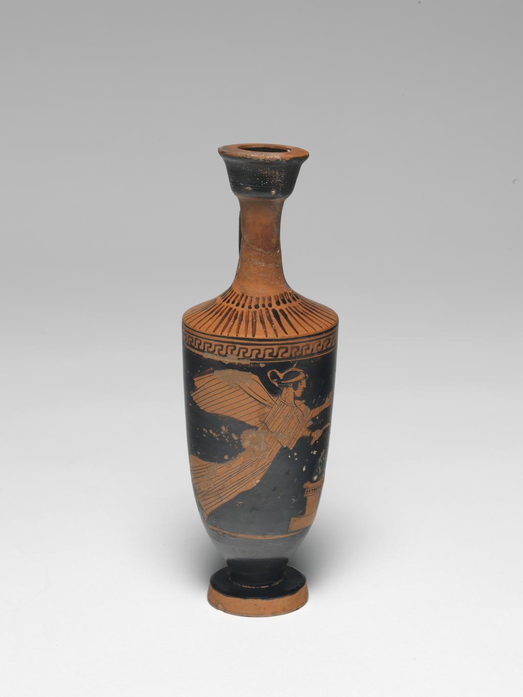 An image of Vessel. Lekythos. Nike. Production Place/Find Spot: Athens,Attica, Greece. Clay, red-figured, height 0.175 m, 470 B.C. Classical Period.