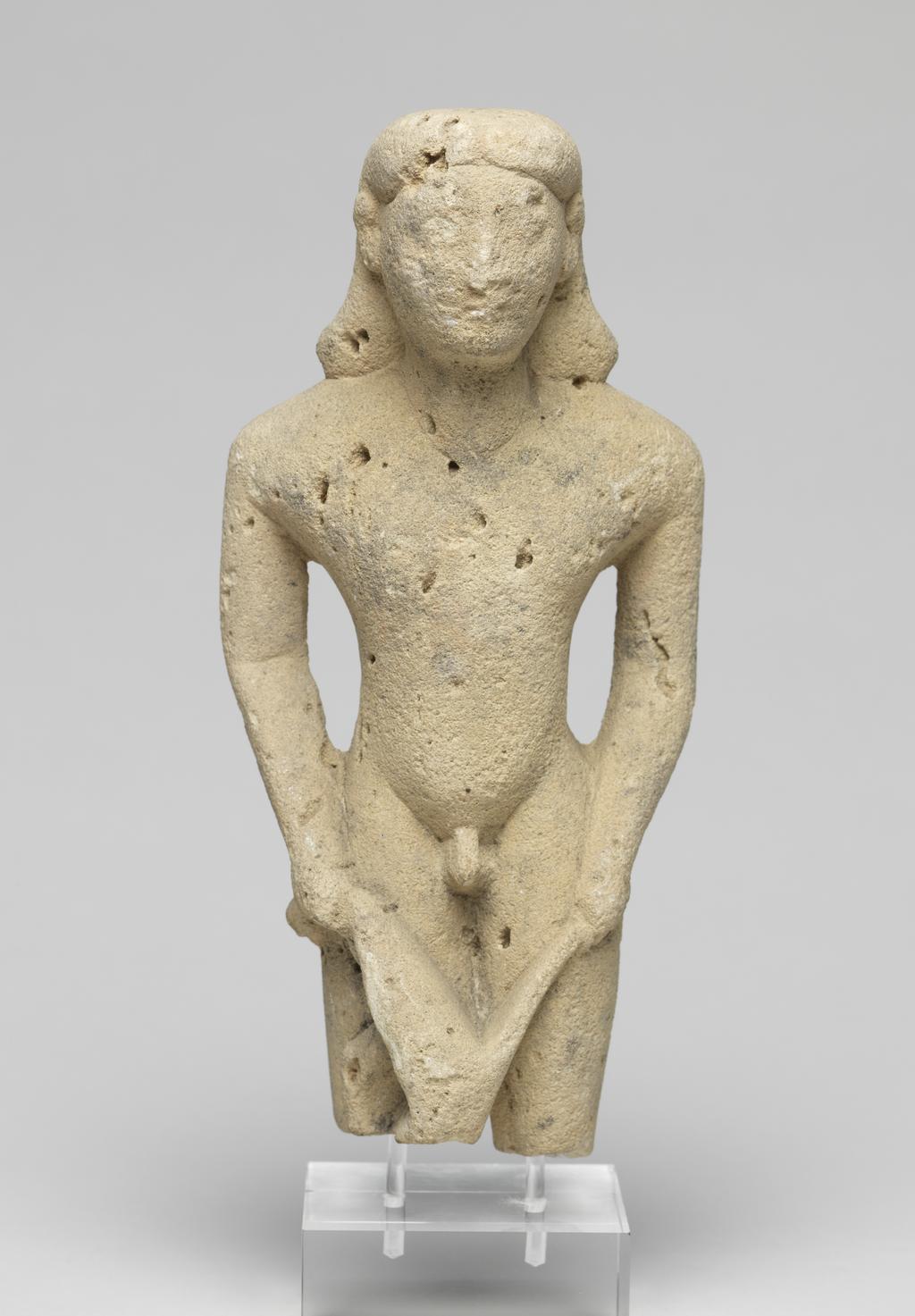 An image of Figure/Statuette. Man, grappling with lion. Production Place: Cyprus. Find Spot: Salamis, Cyprus. Limestone, height 0.175 m, 600-501 B.C. Archaic Period.