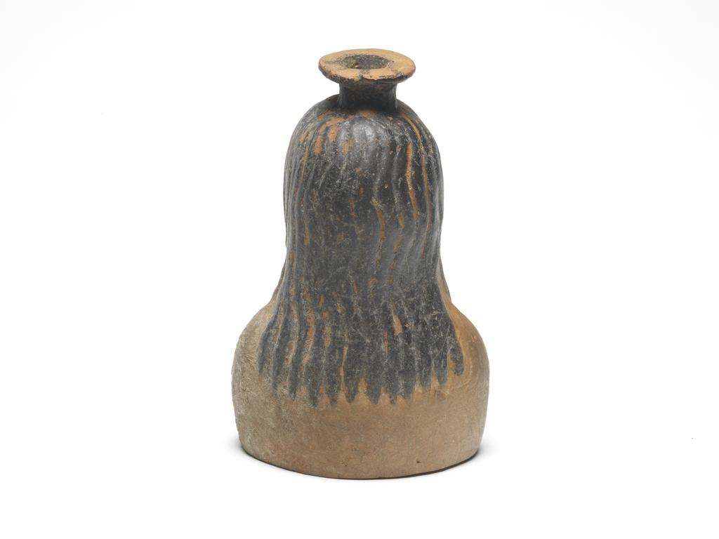 An image of vessel cosmetic vessel perfumed-oil container, in the form of a young man Production Notes  moulded Field Collection  Etruria (Italy) Dimensions height 0.105 mwidth 0.065 mdepth 0.045 m
