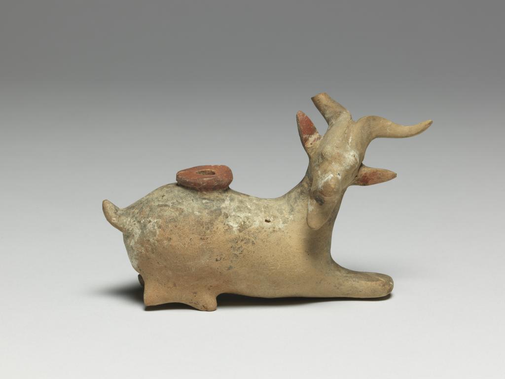 An image of Cosmetic Vessel. Goat, perfumed-oil container. Production Place: East Greece Turkey. Find Spot: Cyprus. Clay, height 0.083 m, length 0.135 m, 600-501 B.C. Archaic Period.