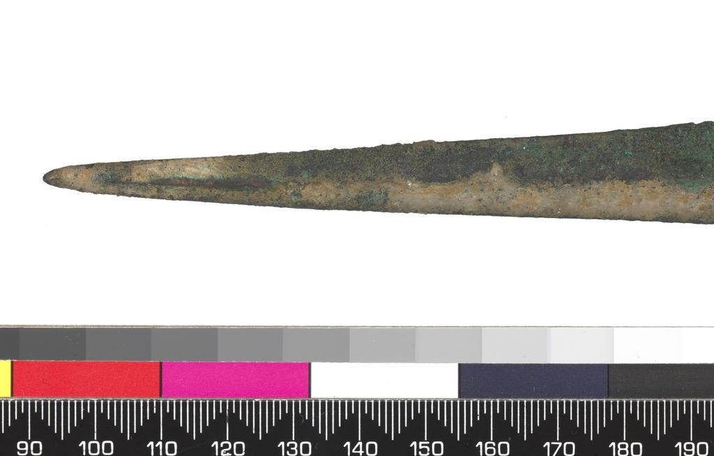 An image of Weapons. Sword. Production Place: Cyprus. Bronze, length 0.289 m, width 0.029 m, 1400-1201 B.C. Late Cypriot II, Bronze Age.
