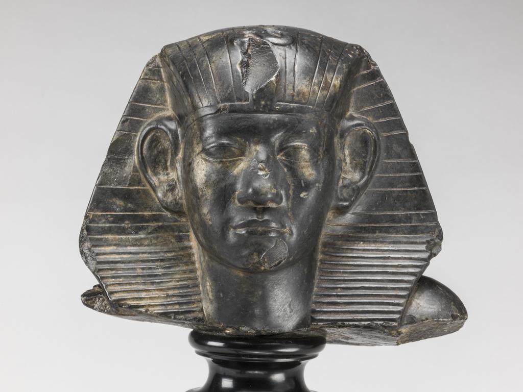 An image of Statue/Figure. Head of King Amenemhet III, wearing nemes head-dress. Find Spot: Aswan, Egypt. Shelly limestone, length 12 cm, width 14.3 cm, circa 1831-circa 1786 B.C. Twelfth Dynasty, Middle Kingdom. Reign of Amenemhat III. Production Notes: Only the shoulders and head are preserved; the base is modern. The statue was found in a private tomb. The facial features are a softer version of the so-called 'realistic portraits' of Senusret III. In this way the ruler was able to promote a visual link to his predecessor.