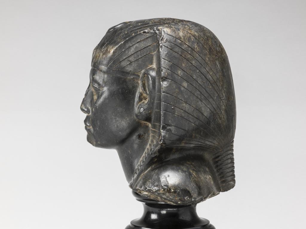 An image of Statue/Figure. Head of King Amenemhet III, wearing nemes head-dress. Find Spot: Aswan, Egypt. Shelly limestone, length 12 cm, width 14.3 cm, circa 1831-circa 1786 B.C. Twelfth Dynasty, Middle Kingdom. Reign of Amenemhat III. Production Notes: Only the shoulders and head are preserved; the base is modern. The statue was found in a private tomb. The facial features are a softer version of the so-called 'realistic portraits' of Senusret III. In this way the ruler was able to promote a visual link to his predecessor.