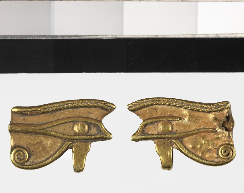 An image of Jewellery/Amulet. Wedjat eye. Production Place: Egypt. Length 0.015 m.