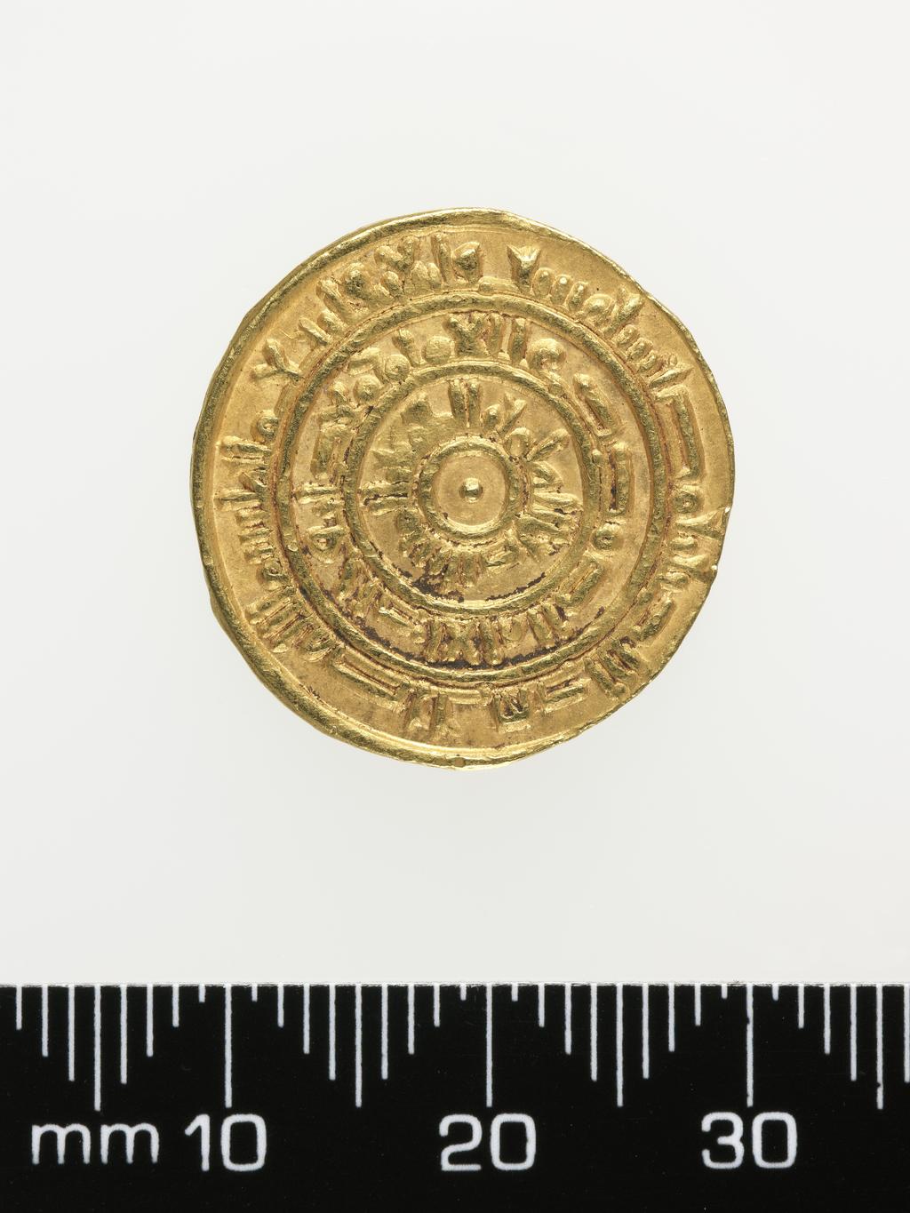 An image of Coinage. Dinar. Al-Mustansir (1036-94), ruler, Egypt. Misr mint, Egypt. Egypt and Syria. Fatimids. Obverse; Plain circle with a dot in the middle, 1st margin in plain circle, 2nd margin in plain circle, 3rd margin. Reverse; Plain circle with a dot in the middle, 1st margin in plain circle, 2nd margin in plain circle, 3rd margin. Gold, height 21 mm, width 21 mm, weight 4.17 g, 1054-1055. Islamic.