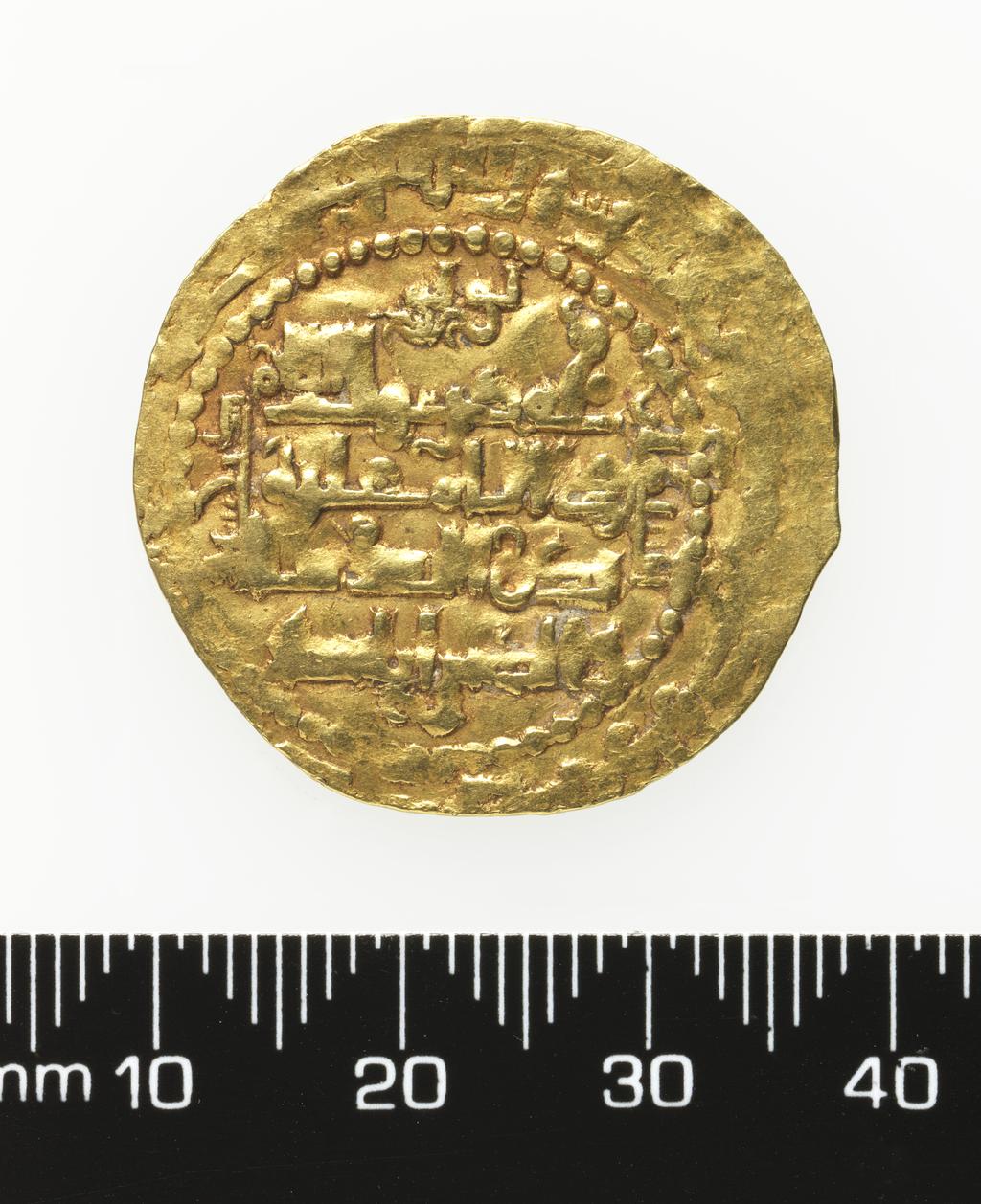 An image of Coinage. Islamic Coin: Dinar. Badr al-Din Lu'lu' (1233-58), ruler. Mosul, Al-Mawsil, Mint. The Atabegs & Contemporaries. Lu'lu'ids. Obverse: Central legend; mint and date formula in inner margin, outer circle, outer margin. Reverse: Legend in dotted circle, legend r. vertically upwards and l. vertically downwards. Gold, height 28 mm, width 29 mm, weight 5.14 g, 1233-1258.