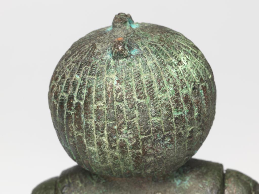 An image of Figure/Statuette. Production Place: Egypt. The prominent pubic triangle suggests that the figure was associated with fertility. Such representations were found in graves as early as the Middle Kingdom; during the earlier periods such objects were typically made from wood, clay, ivory or bone. A connection to fertility would explain why the subject is naked- this is extremely rare in Egyptian art. This figure has moveable arms, inlaid eyes (now missing) and once wore a headdress or crown, as indicated by the tenon on top of the head. The short wig identifies the subject as Nubian (southern Egypt or Sudan) and the rounded, broad face suggests that the female was African. The figure was hollow cast in several pieces and is in good condition. Copper alloy, body cast hollow in one piece, arms cast separately, obsidian pubic triangle inlay, height 21.8 cm, circa 747- circa 656 B.C. Twenty-fifth Dynasty.