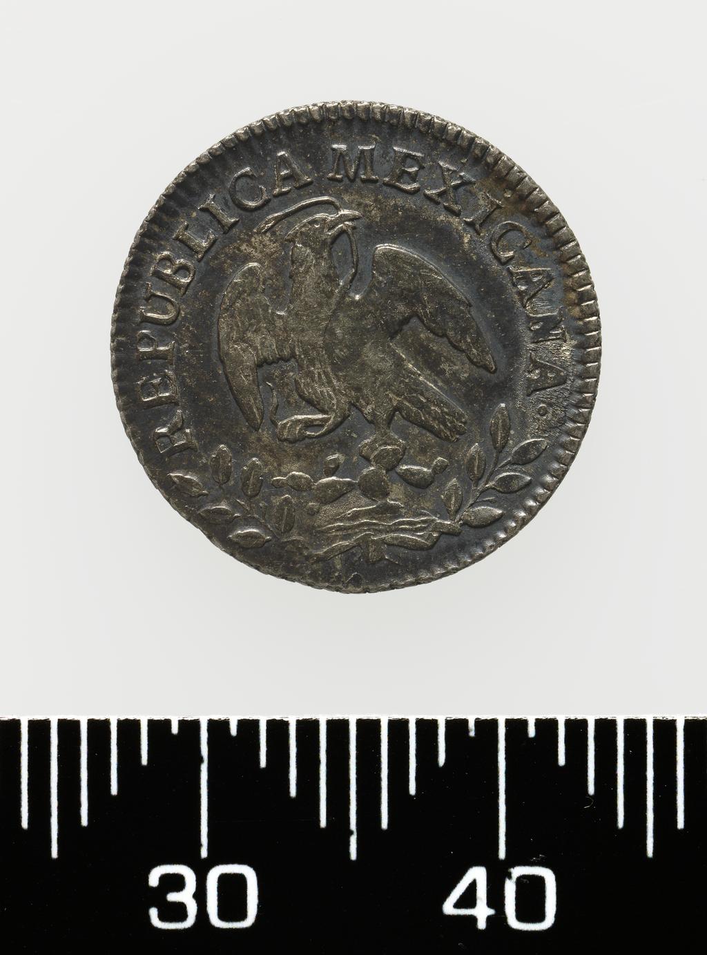 An image of Coinage. Half Real. Mexico City mint. Silver, milled, diameter 17 mm, 1858. Acquisition: On loan from Queens' College Cambridge. Alternative Number: Q-4928.