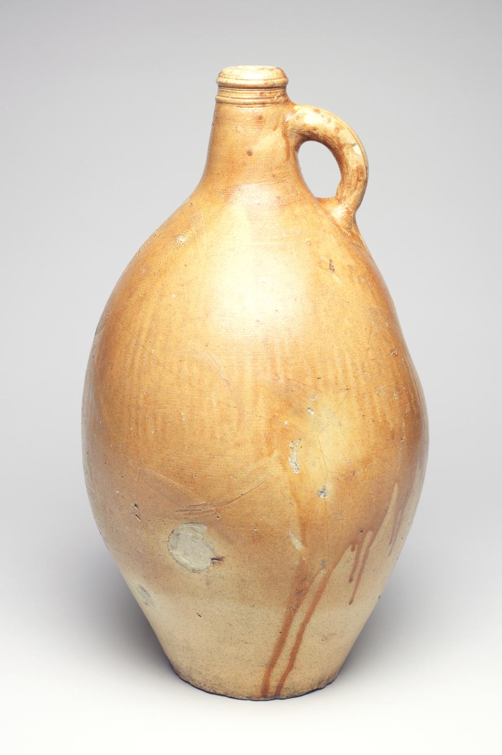 An image of Studio Ceramics. Large salt-glazed stoneware jar, with a lug handle. The figure '4' is inscribed on the shoulder. 1700-1799. German. Acquisition: Dr John Shakeshaft Bequest.