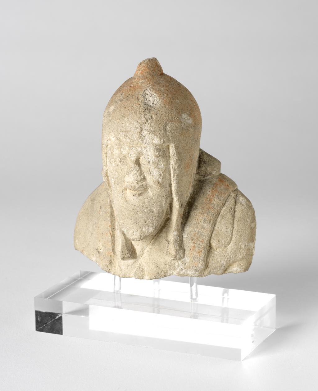 An image of Figure/statuette. Man, wearing cap. Production Place: Cyprus. Find Spot: Salamis, Cyprus. Limestone, height 0.09 m, 600-501 B.C. Archaic Period.