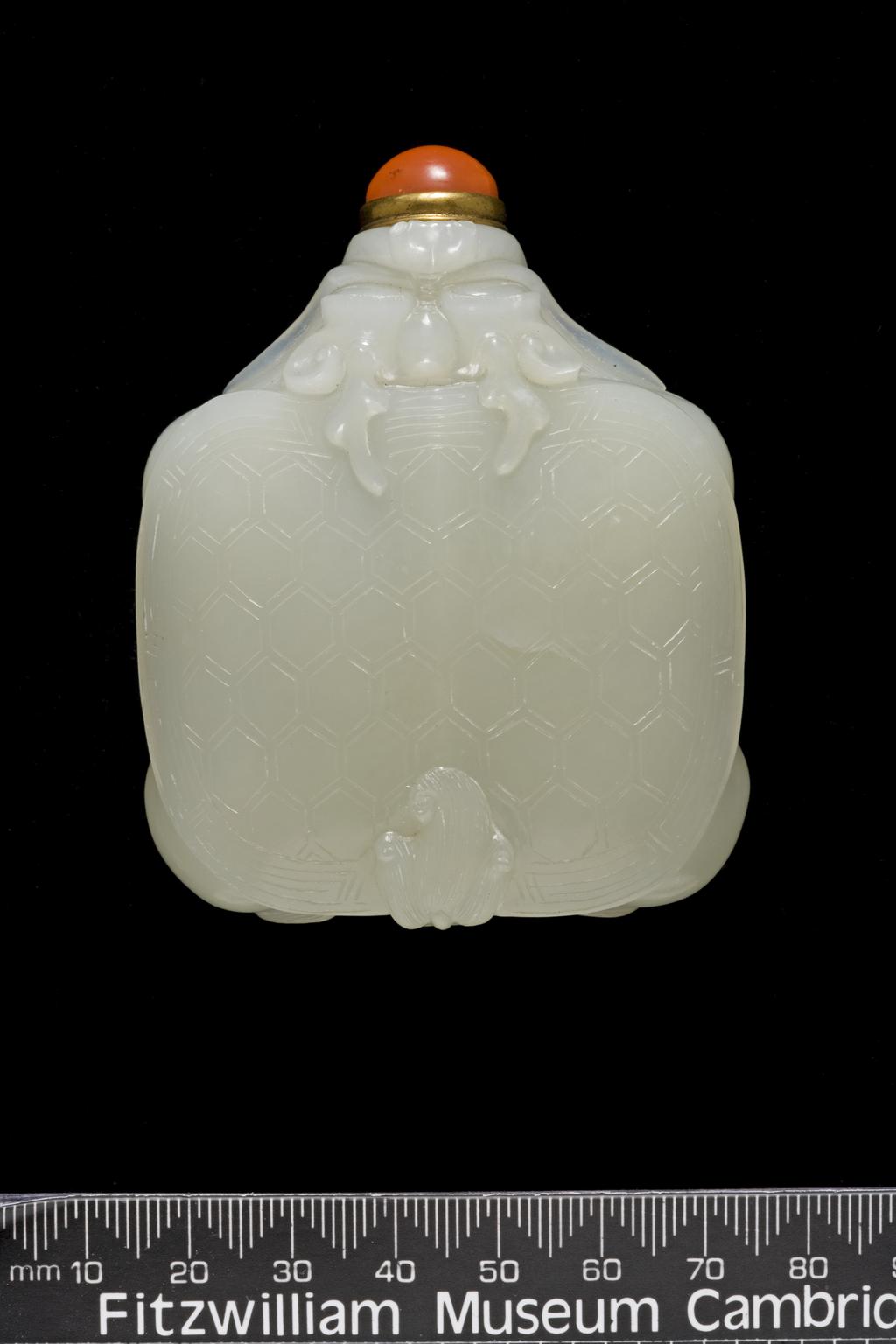 An image of Snuff Bottle. Nephrite of greyish/white colour, carved in the form of a mythological turtle. Height 6.7 cm. 1760-1860. Qing Dynasty (1644-1912). Chinese