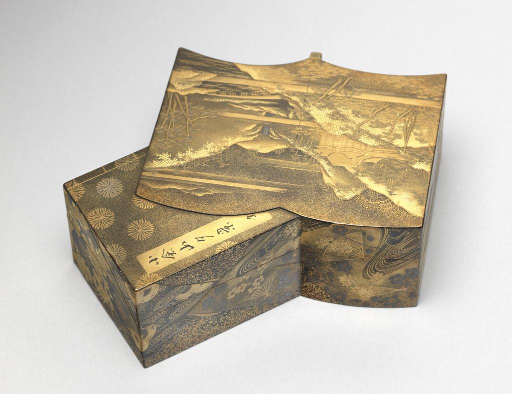 An image of Box, lid and tray. Unknown maker, Japan. Box in the shape of two intersecting books, one open and one closed with a seated lid (A) and containing a tray (B). The open book is decorated in gold and silver-grey hiramakie (low-relief sprinkled design) and takamakie (high-relief sprinkled design) and togidashi (brought out by polishing) with a mountainous landscape, trees, a waterfall, a bridge spanning a river and a pavilion on a black and gold powdered ground. The closed book is decorated in togidashi with gold flower heads on a black and gold powdered ground, with gold bindings and the title in a gold rectangular panel. The title reads `A View of Konensan `, the last character meaning 'complete in one volume.' The sides are finely decorated with intricate brocades of flower heads, leaves, ducks, fans and diaper patterns in gold, red and silver-grey on a black nashiji (shimmering spangles) ground. The tray is finely decorated in gold, red and silver-grey with sprays of autumn flowers and foliage on a black and gold powdered ground with a gold rim. The base of the tray is nashiji.The inside and the base are nashiji. Lacquer, decorated in hiramakie (low-relief sprinkled design), takamakie (high-relief sprinkled design), togidashi (brought out by polishing) and nashiji, height, whole, 4.0 cm, width, whole, 11.0 cm, length, whole, 11.8 cm, circa 1700-1868. Edo (1615-1868). Acquisition: