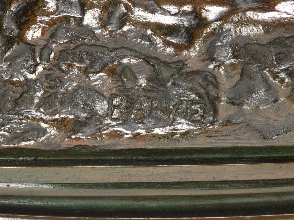 An image of A Lion crushing a Serpent. Barye, Antoine Louis (French, 1796-1875). Bronze, height 16.8 cm, length 21.5 cm, width 10.5 cm, between 1825-1875.