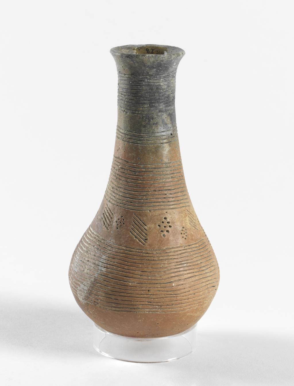 An image of Vessel. Flask. Production Place: Cyprus. Find Spot: Vounous Cyprus; Tomb 154. Clay, red-polished ware, height 0.165 m, width 0.084 m, 2400 to 2201 B.C. Early Cypriot I. Bronze Age.