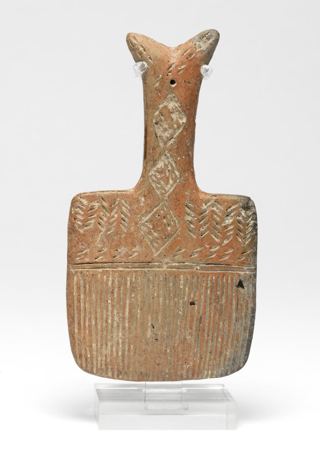 An image of Model of brush. Production Place: Cyprus. Find Spot: Vounous Cyprus; Tomb 121. Clay, red-polished ware, depth, 0.014 m, height 0.134 mwidth 0.073 m, 2200 to 2101 B.C. Early Cypriot II. Bronze Age.