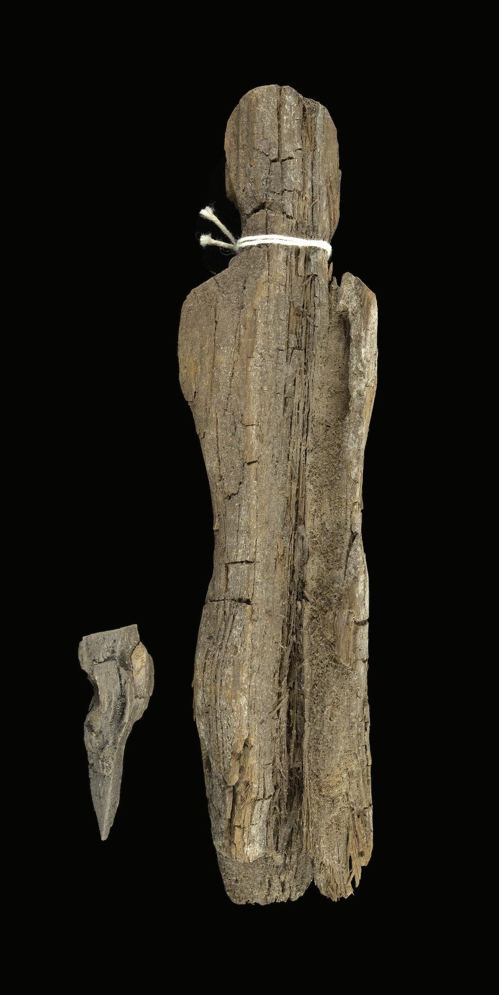 An image of Statuette. Male (?) figure, standing, poor condition. Production Place: Egypt. Wood, height 0.18 m.