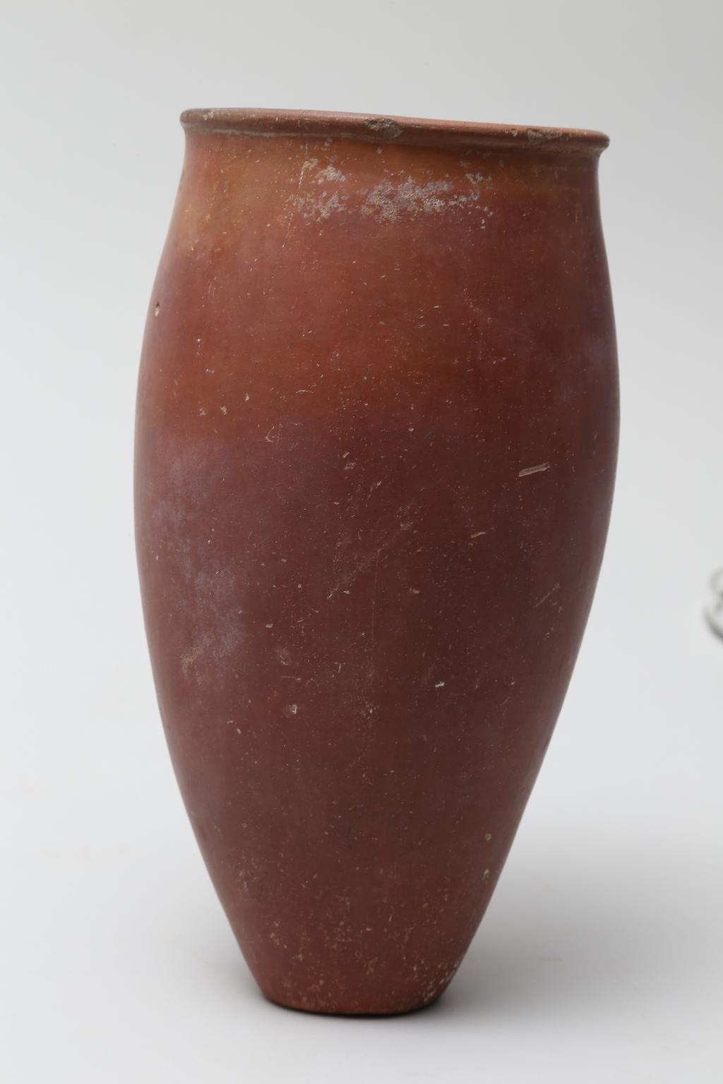 An image of Vessel. Jar, slender with black rim. Production Place/Find Spot: Egypt. Height 0.214 m, diameter, rim, 0.101 m, width, body, 0.112 m, c. 4500-3500 B.C. Nagada II & Predynastic period.