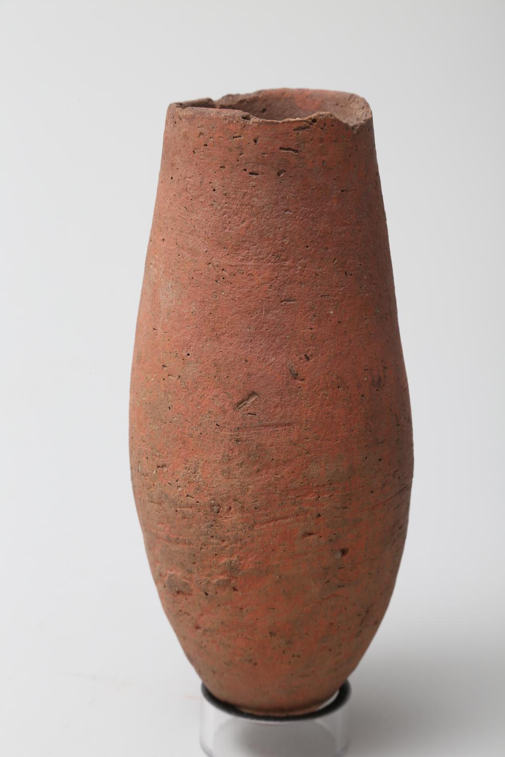 An image of Vessel. Jar, with straight sides and pointed base. Production Place/Find Spot: Egypt. Height 0.155 m. Eighteenth Dynasty. New Kingdom.