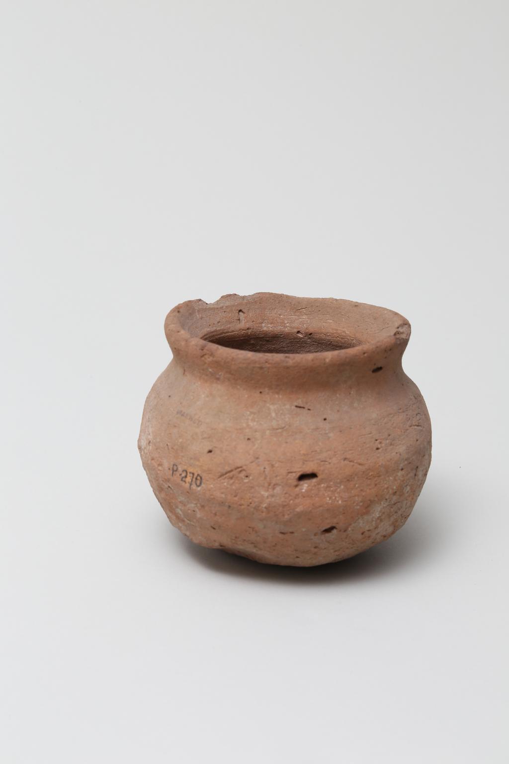 An image of Vessel. Jar, with rounded base, wide mouth. Production Place/Find Spot: Egypt. Height 0.085 m.