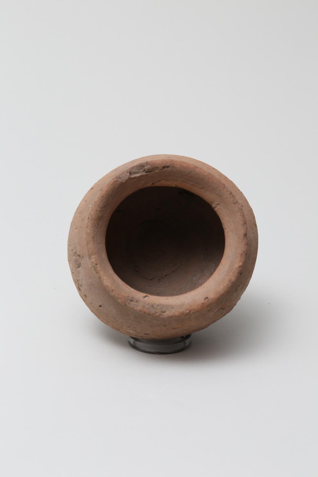 An image of Vessel. Jar, with rounded base, wide mouth. Production Place/Find Spot: Egypt. Height 0.085 m.