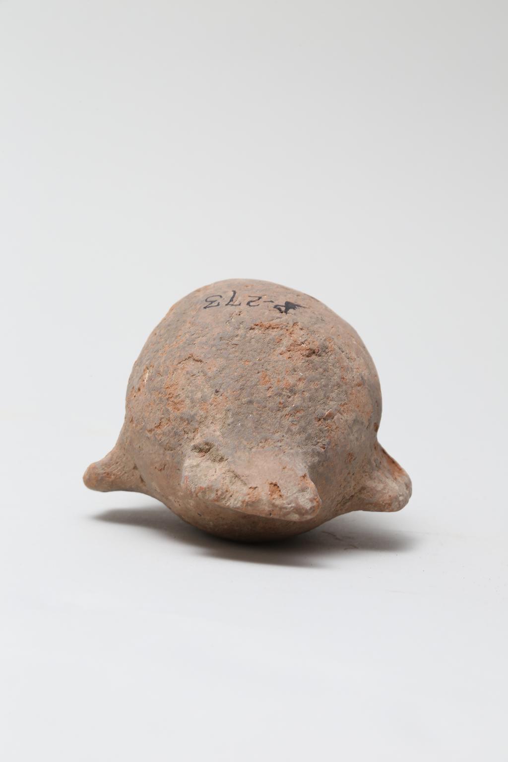 An image of Vessel. Jar, in the form of a bird ?, head missing. Find Spot: Naukratis?, Egypt. Production Place: Egypt. Height 0.105 m.