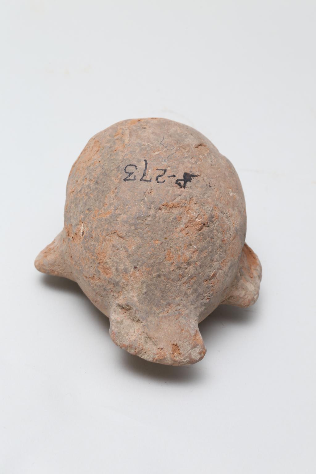 An image of Vessel. Jar, in the form of a bird ?, head missing. Find Spot: Naukratis?, Egypt. Production Place: Egypt. Height 0.105 m.